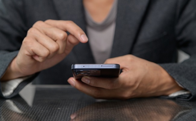 A,Close-up,Image,Of,A,Person's,Hands,Using,A,Smartphone
