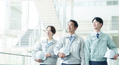 Portrait,Of,Asian,Engineer,In,Workwear,With,Helmet,Looking,At
