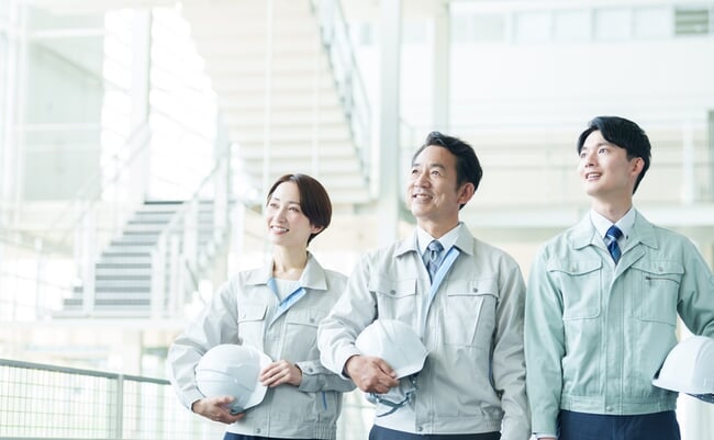 Portrait,Of,Asian,Engineer,In,Workwear,With,Helmet,Looking,At