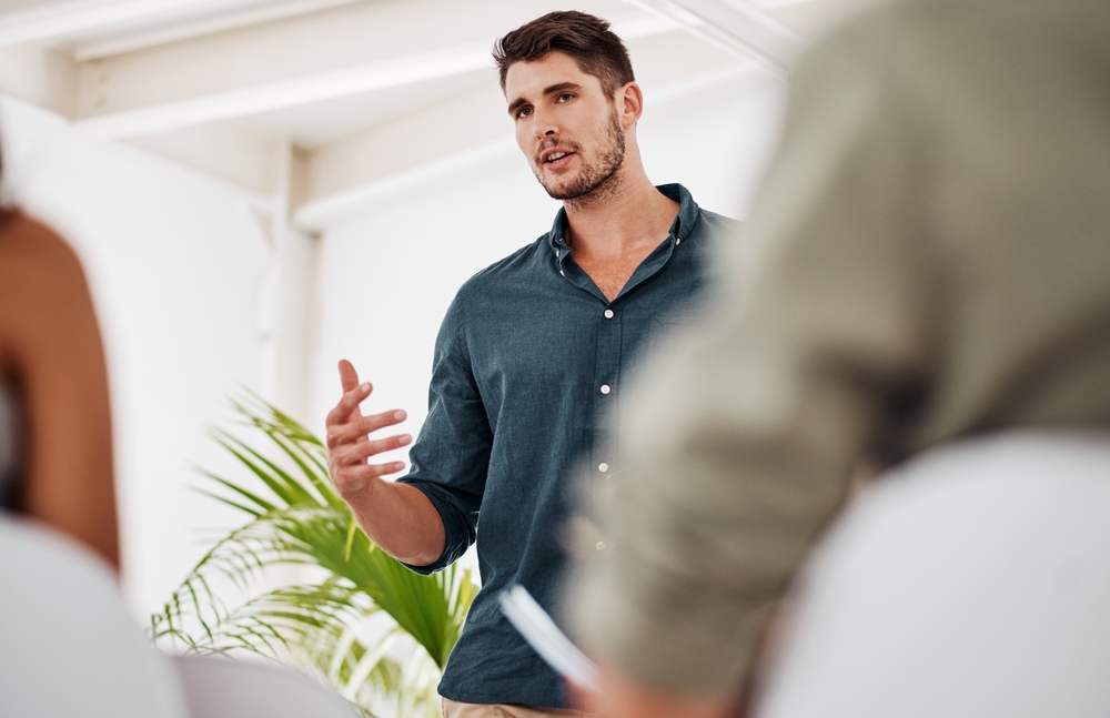 Man,,Talking,And,Presentation,In,Office,For,Team,Building,,Training