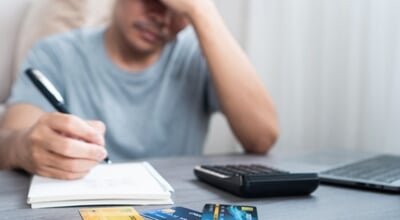 Asian,Man,Feeling,Stressed,And,Worried,Because,Of,Unpaid,Bills