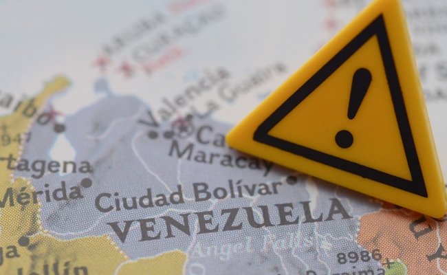 Venezuela,Crisis,Warning,Sign,On,Map,,Travel,Advisory,And