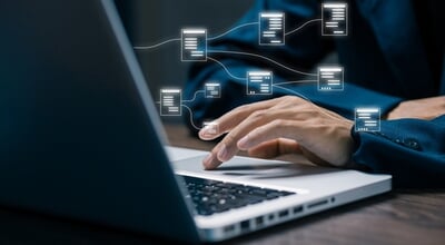 Hand,Typing,On,Laptop,With,Floating,Data,Flow,Nodes,,Representing