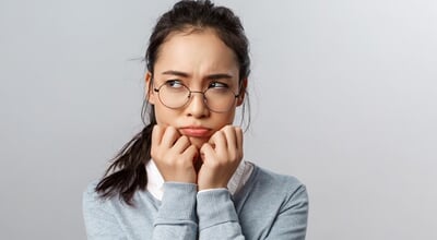 Close-up,Of,Gloomy,Offended,Young,Silly,Asian,Woman,,Sulking,Frowning