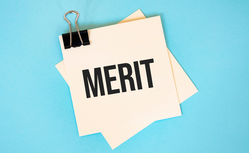 Text,Merit,On,Sticky,Notes,With,Copy,Space,And,Paper