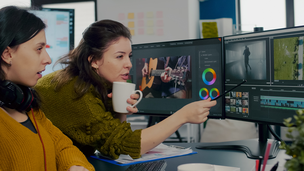 Coworkers,Video,Editors,Discussing,In,Front,Of,Pc,Working,For