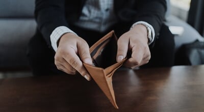 A,Businessman,In,A,Black,Suit,Holding,And,Opening,An