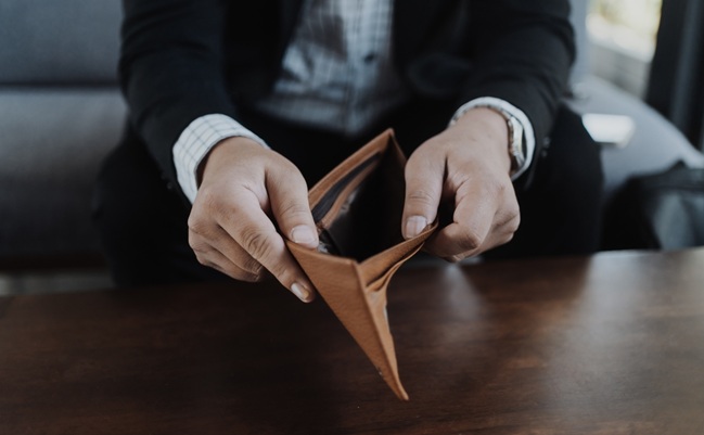 A,Businessman,In,A,Black,Suit,Holding,And,Opening,An