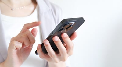Hands,Of,A,Businesswoman,Using,A,Smartphone
