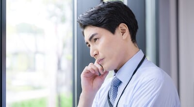Close-up,Of,A,Businessman,Pondering,By,The,Window,Career,Worries:
