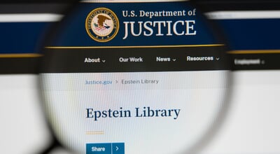 Magnifying,Glass,Over,A,Computer,Screen,Showing,The,Epstein,Library