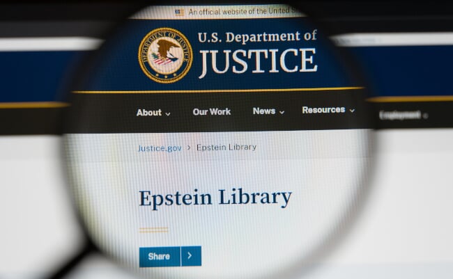 Magnifying,Glass,Over,A,Computer,Screen,Showing,The,Epstein,Library