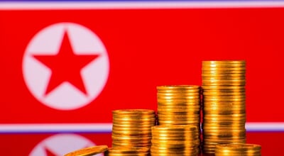 A,Stack,Of,Gold,Coins,On,The,Background,Of,The