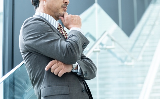 Middle-aged,Asian,Businessman,Thinking,In,Office