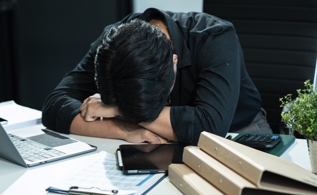 Young,Stressed,Asian,Businessman,Working,In,The,Office.,Businessman,Thinking