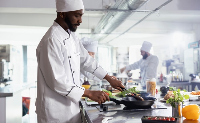 African,American,Chef,Cooking,Wagyu,Beef,Steak,With,Tongs,In