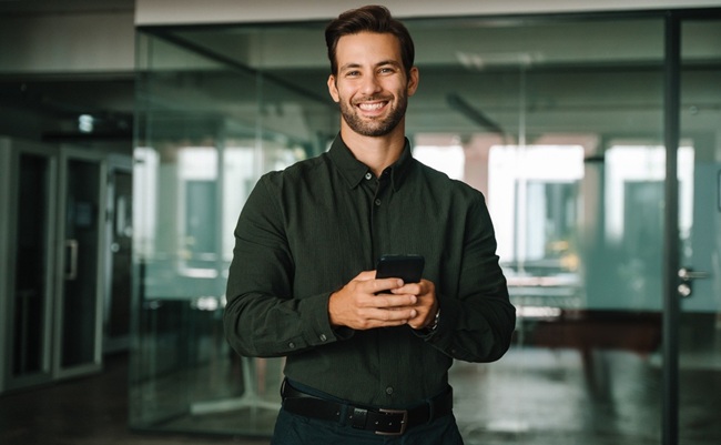 Young,European,Business,Man,Manager,Trader,Using,Cell,Phone,Mobile
