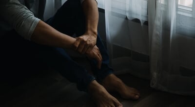 Alone,Man,Silhouette,Staring,At,The,Window,Closed,With,Curtains