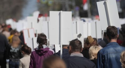 Protester,Crowd,Carry,Propaganda,Banner,Sign.,Demonstration,People,Move,Along