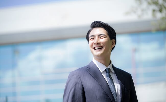 Close-up,Of,A,Young,Male,Office,Worker,Smiling,And,Looking