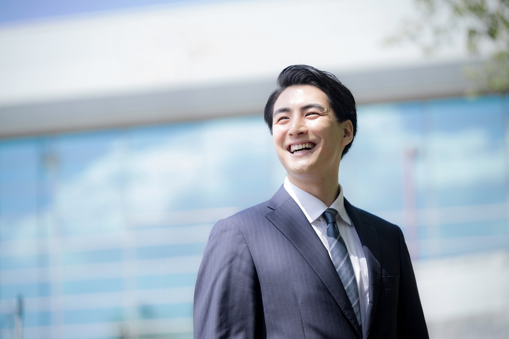 Close-up,Of,A,Young,Male,Office,Worker,Smiling,And,Looking