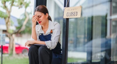Small,Business,Owner,Worried,About,Her,Closed,Cafe,,Sitting,Outside