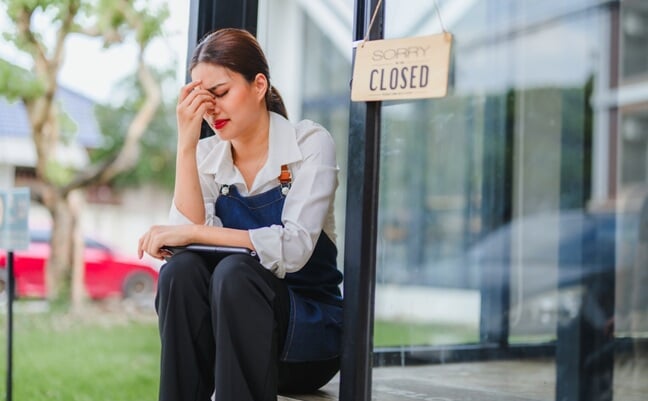 Small,Business,Owner,Worried,About,Her,Closed,Cafe,,Sitting,Outside