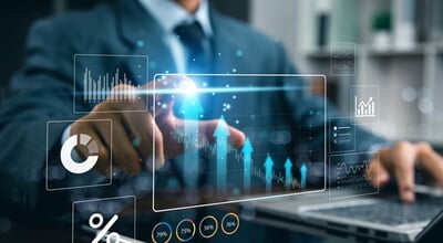 Businessman,Analyzing,Financial,Data,And,Digital,Marketing,Charts,On,Laptop,