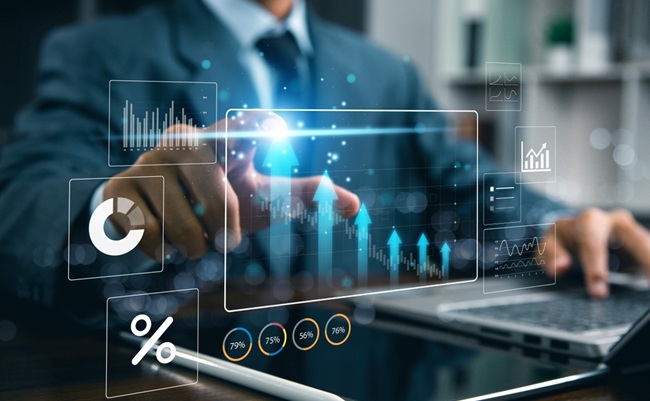 Businessman,Analyzing,Financial,Data,And,Digital,Marketing,Charts,On,Laptop,