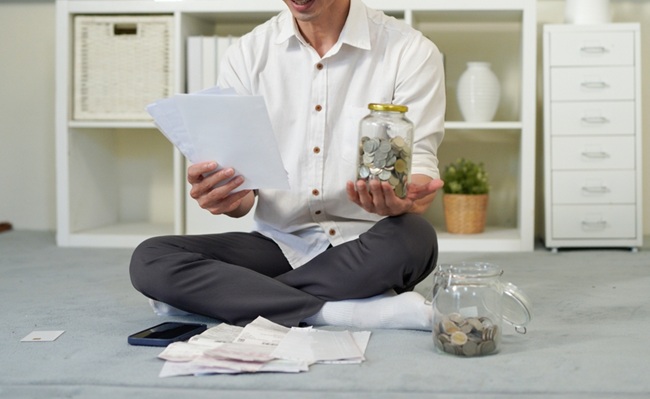 Male,Office,Worker,Holds,Bills,In,Hands,Counting,Amount,Of