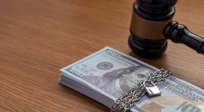 A,Judge's,Gavel,Next,To,A,Stack,Of,Money,Bound