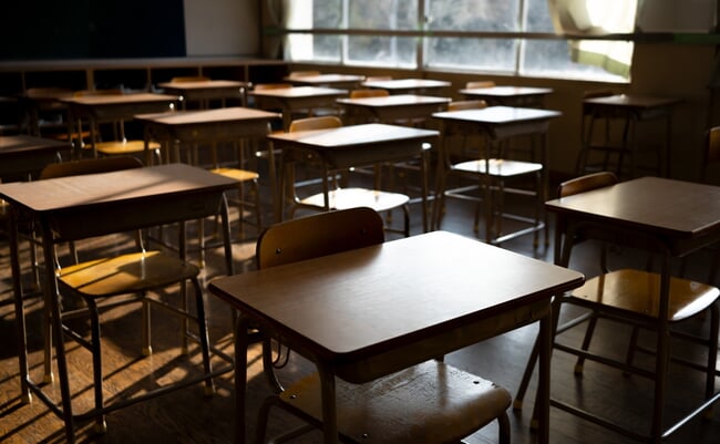 Empty,Japanese,Classroom,With,Wooden,Desks,,Bathed,In,Warm,Sunlight