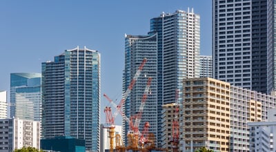 Modern,High-rise,Apartment,Buildings,And,Construction,Cranes,In,Tokyo,,Japan