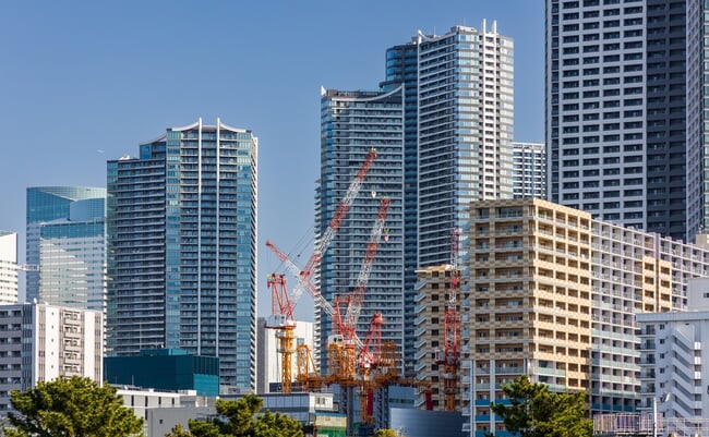 Modern,High-rise,Apartment,Buildings,And,Construction,Cranes,In,Tokyo,,Japan