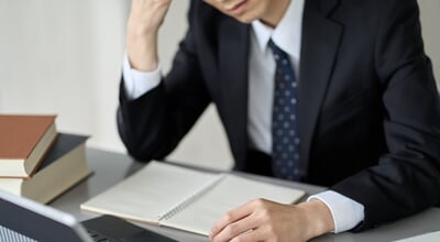 Worried,Asian,Businessman,Holding,His,Head