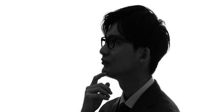 Profile,Silhouette,Of,A,Thinking,Asian,Businessman.