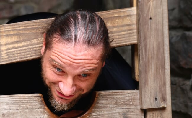 Checiny,,Poland,-,07.25.2025:,A,Man,In,The,Wooden,Stocks