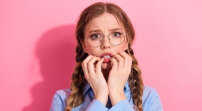 A,Young,Woman,With,Braided,Hair,And,Glasses,Wearing,A