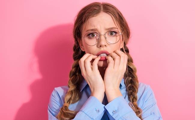 A,Young,Woman,With,Braided,Hair,And,Glasses,Wearing,A