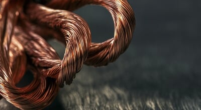 Close,Up,Of,Coiled,Copper,Wire,Resting,On,A,Metal