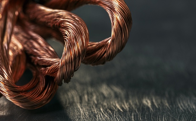 Close,Up,Of,Coiled,Copper,Wire,Resting,On,A,Metal