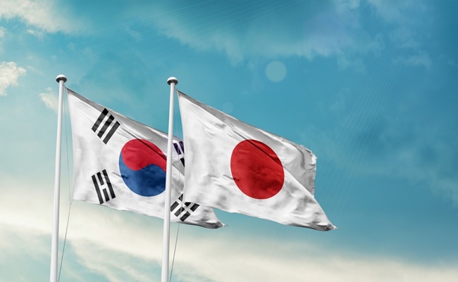 South,Korea,Japan,Friendship,Flags,Are,Waving,In,The,Sky.