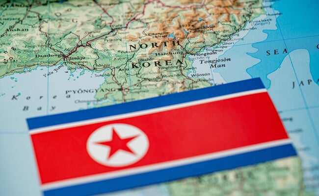 Close,Up,Of,North,Korea,Flag,On,Map,Of,North