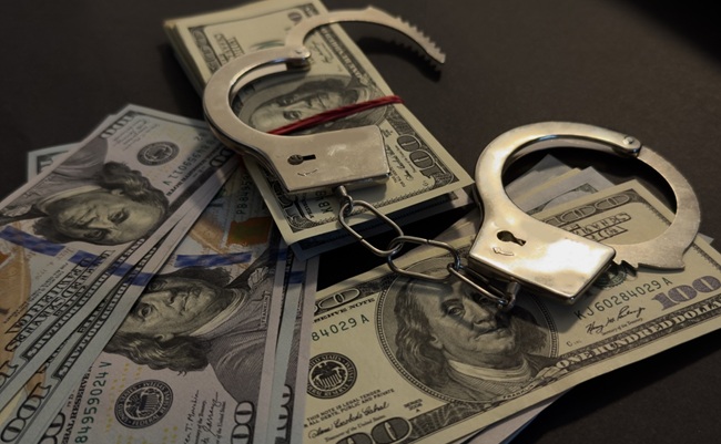 Handcuffs,On,100,Bills,On,Concrete,Floor,For,Crime