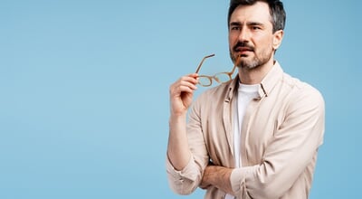 Man,Thinking,Holding,Glasses,,Having,An,Idea,,Solving,Problems,,Looking
