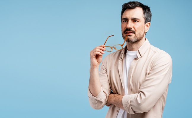Man,Thinking,Holding,Glasses,,Having,An,Idea,,Solving,Problems,,Looking