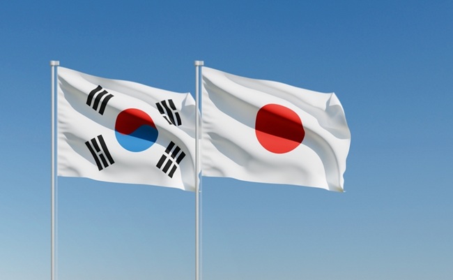 Wavy,South,Korea,And,Japan,Flags,And,Clear,Blue,Sky