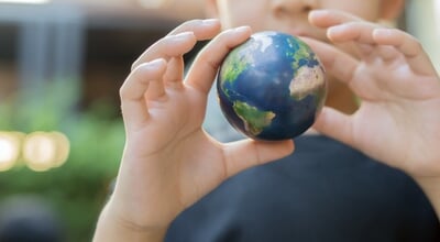 Selective,Focus,Of,Child,Holding,Small,Earth,Globe,Outdoor.,Concept