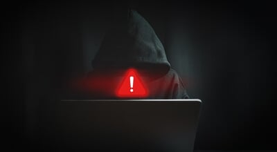 Cyber,Security,Threat,Concept,With,Anonymous,Hacker,Behind,Laptop,And