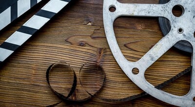 Cinema,And,Filmmaker,Concept,With,Film,Reels,And,Clapperboard.